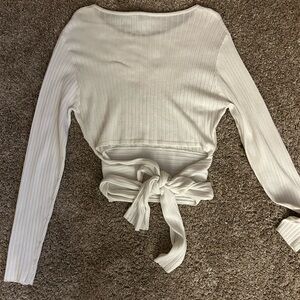 white long sleeve, bow tie in the back